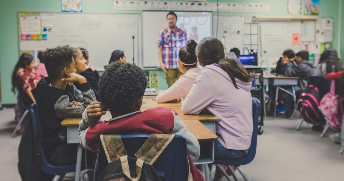 Teacher engaging with students in a diverse classroom